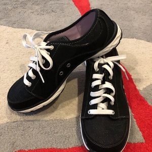 Dr. Scholl’s black and white tennis shoes.